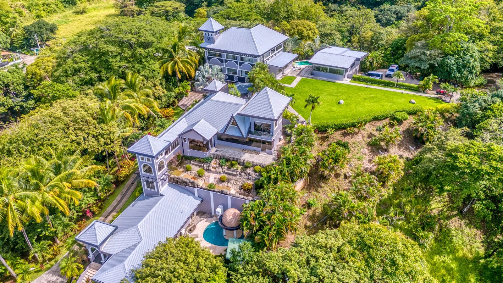 Aerial view of the estate, main house and villas