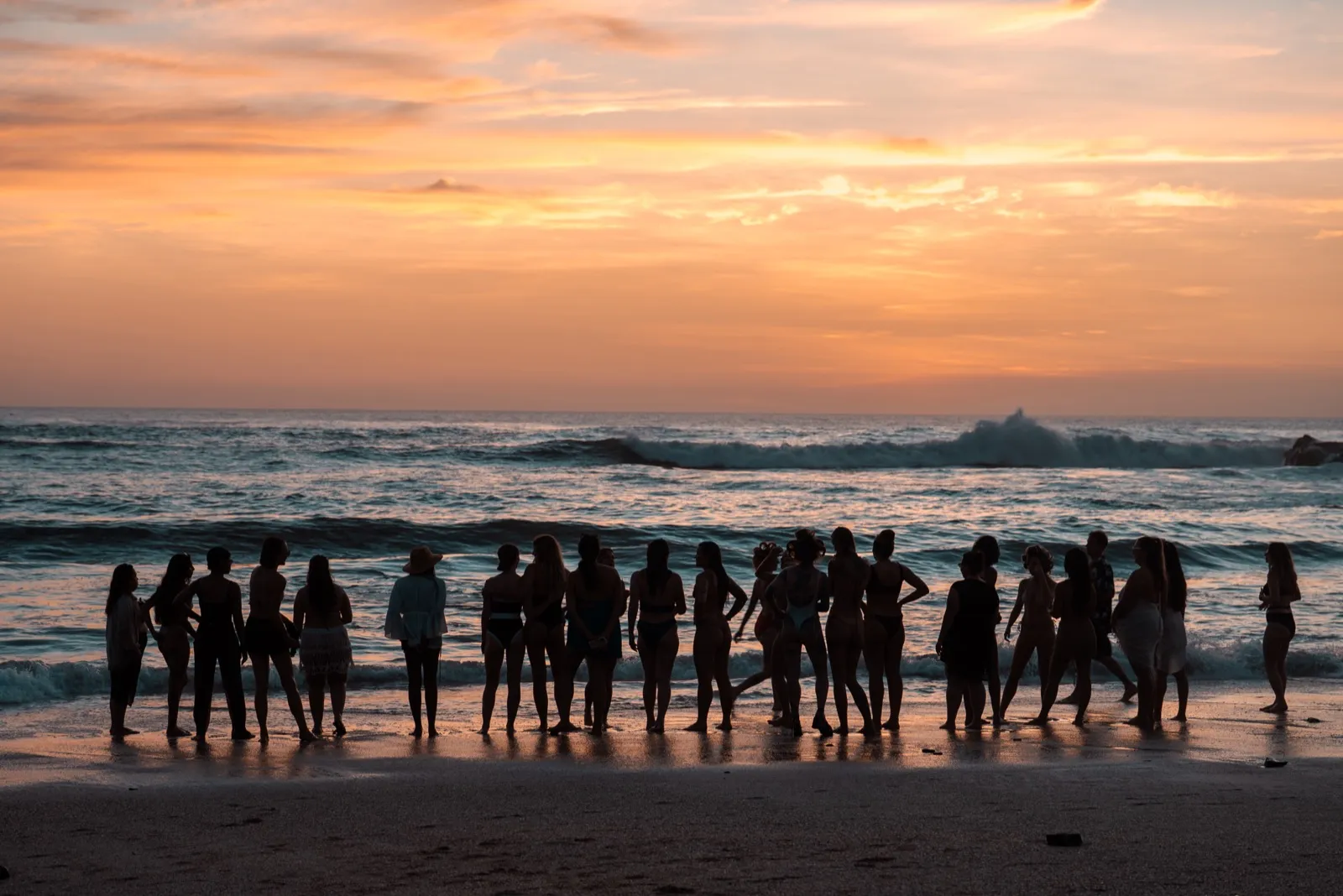 Retreat group at sunset on the beach