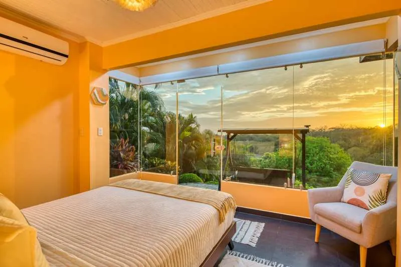 Castillo Colonial Ocean View Queen bedroom at sunset