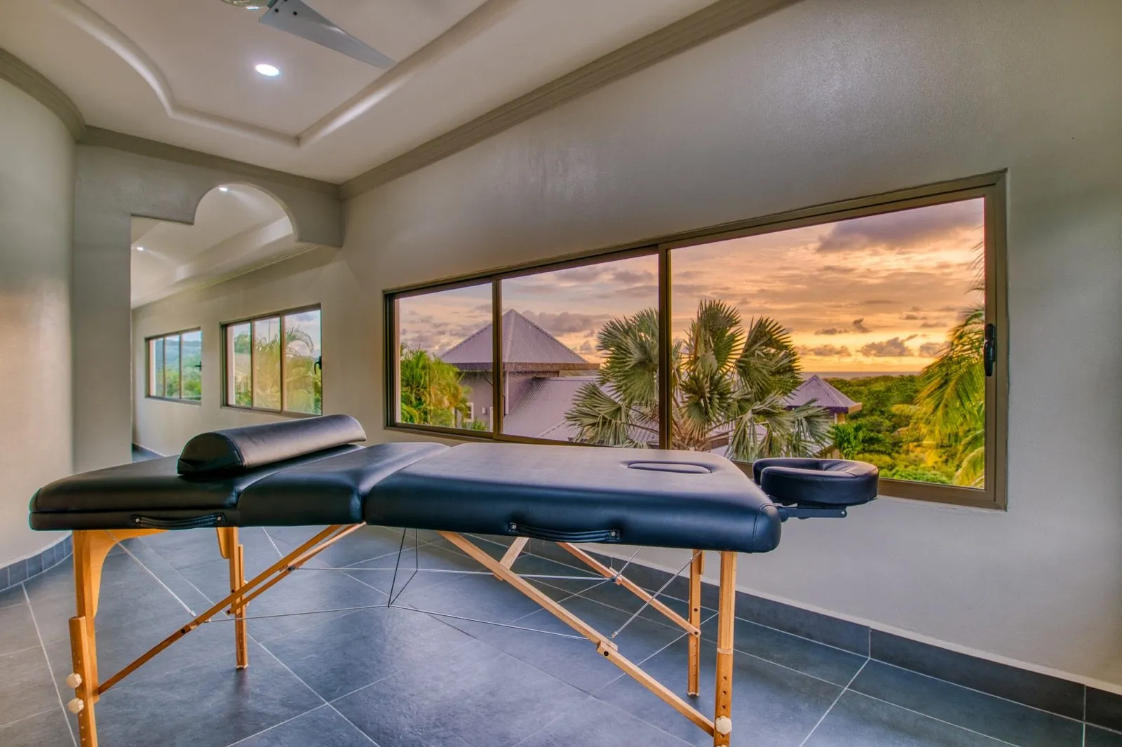 Rooftop villa massage room with sunset view