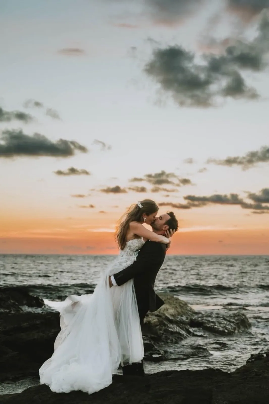A kiss on the beach at sunset