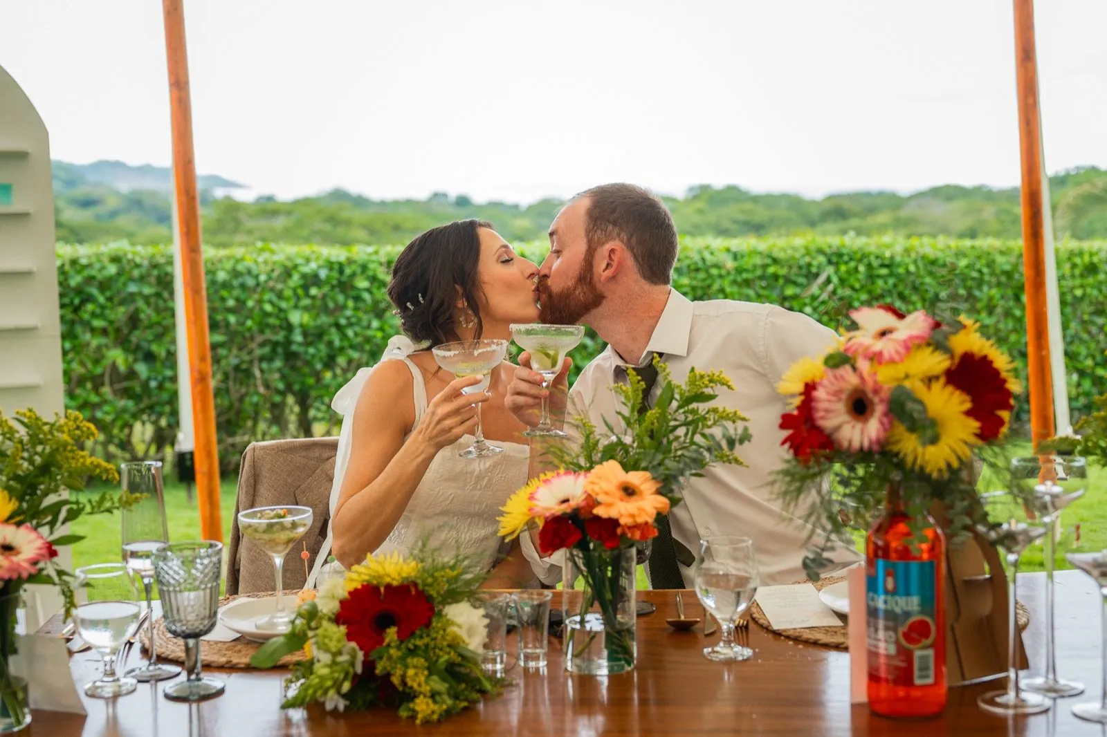 Newlyweds toasting at the sweetheart table