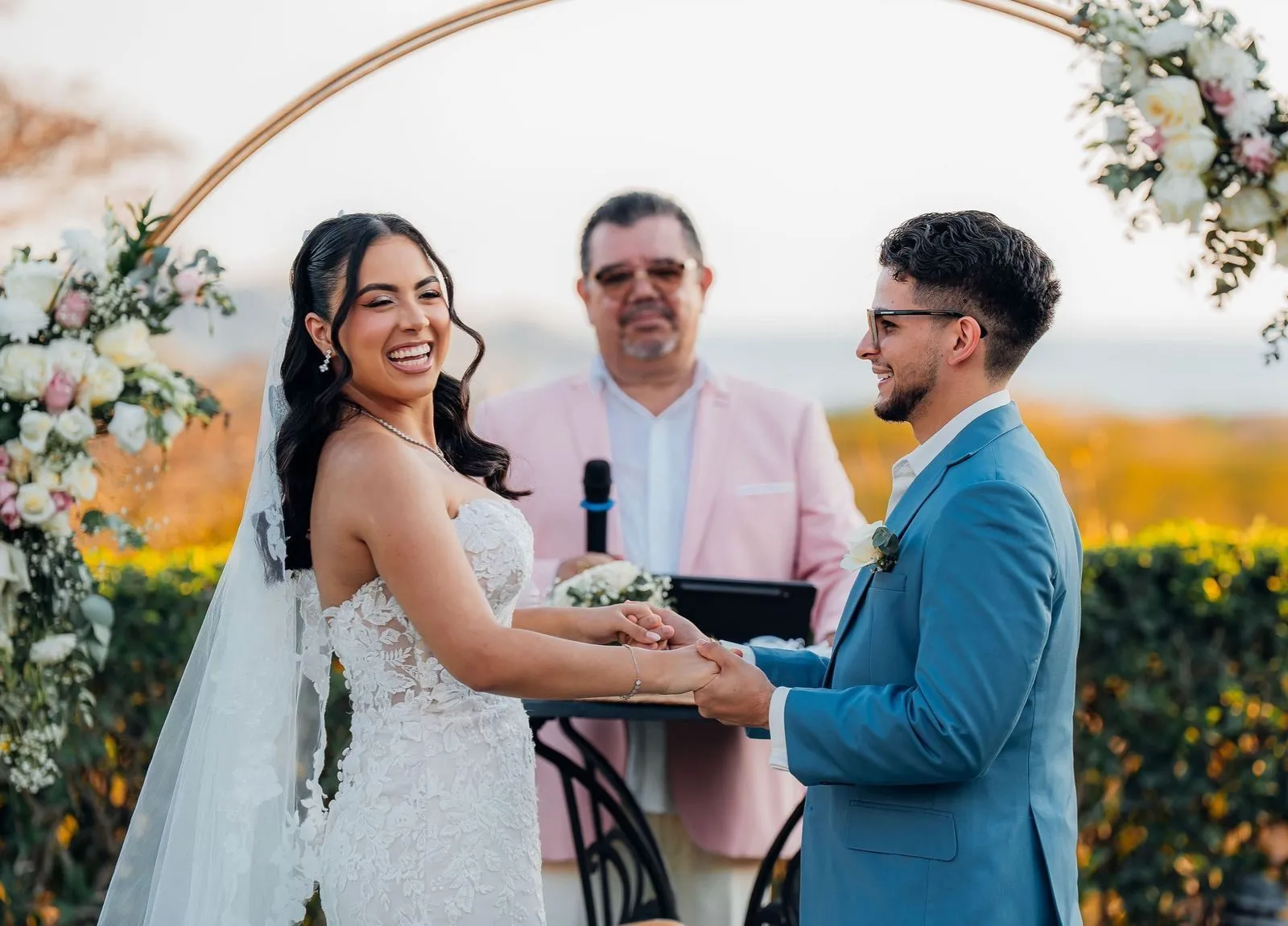 Exchanging vows at the flower arch